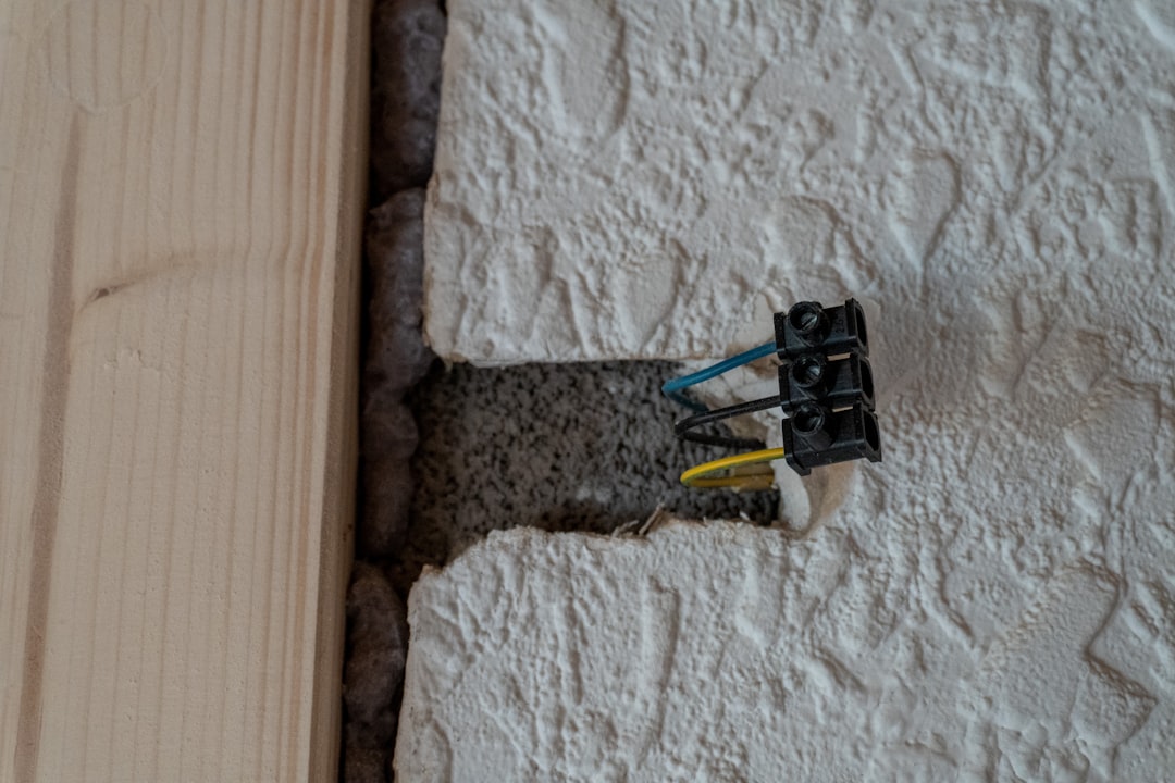 Exposed electrical wires in a textured wall opening