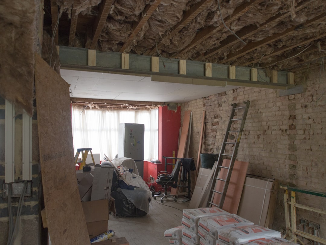 a room filled with lots of boxes and a ladder